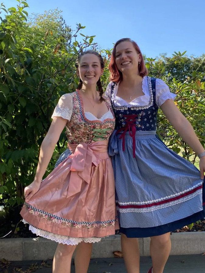Two women wearing traditional German dressings.